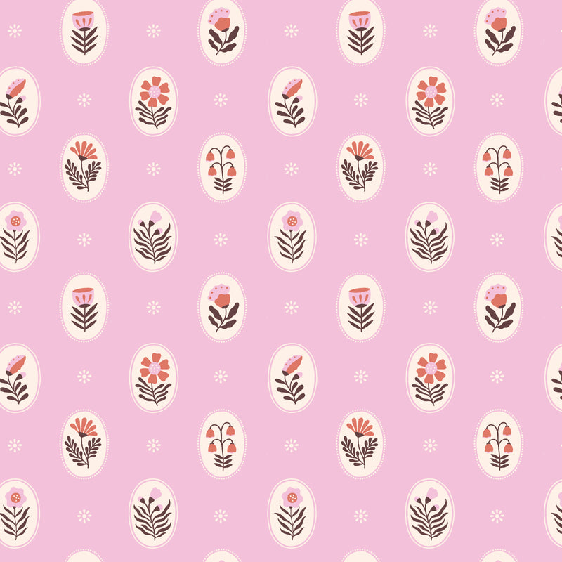 Flat lay of Vera in Bubblegum organic cotton fabric by Cloud9 Fabrics, featuring a dense, whimsical floral pattern of pink and coral wildflowers with dark leafy accents on a warm cream background