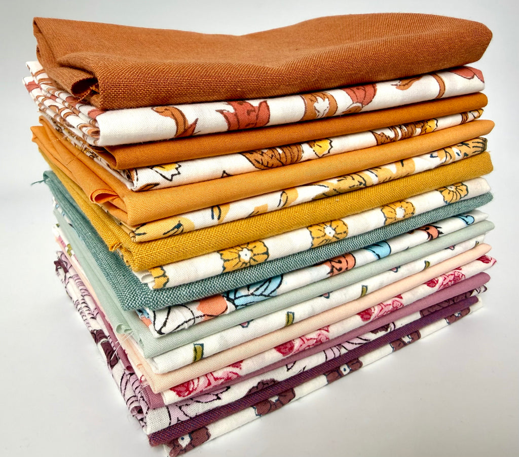 Stack of colorful fabric swatches on a white background
