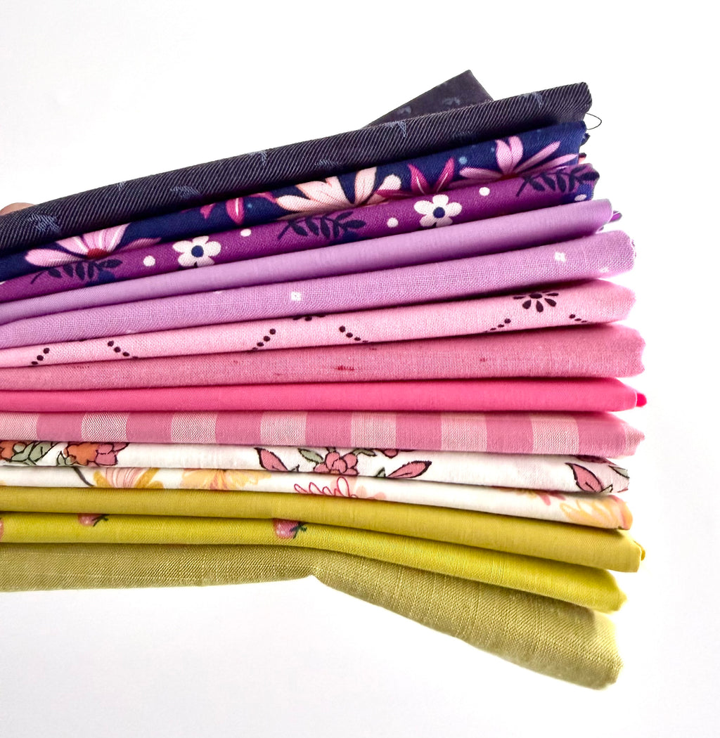 Stack of colorful fabric swatches on a white background