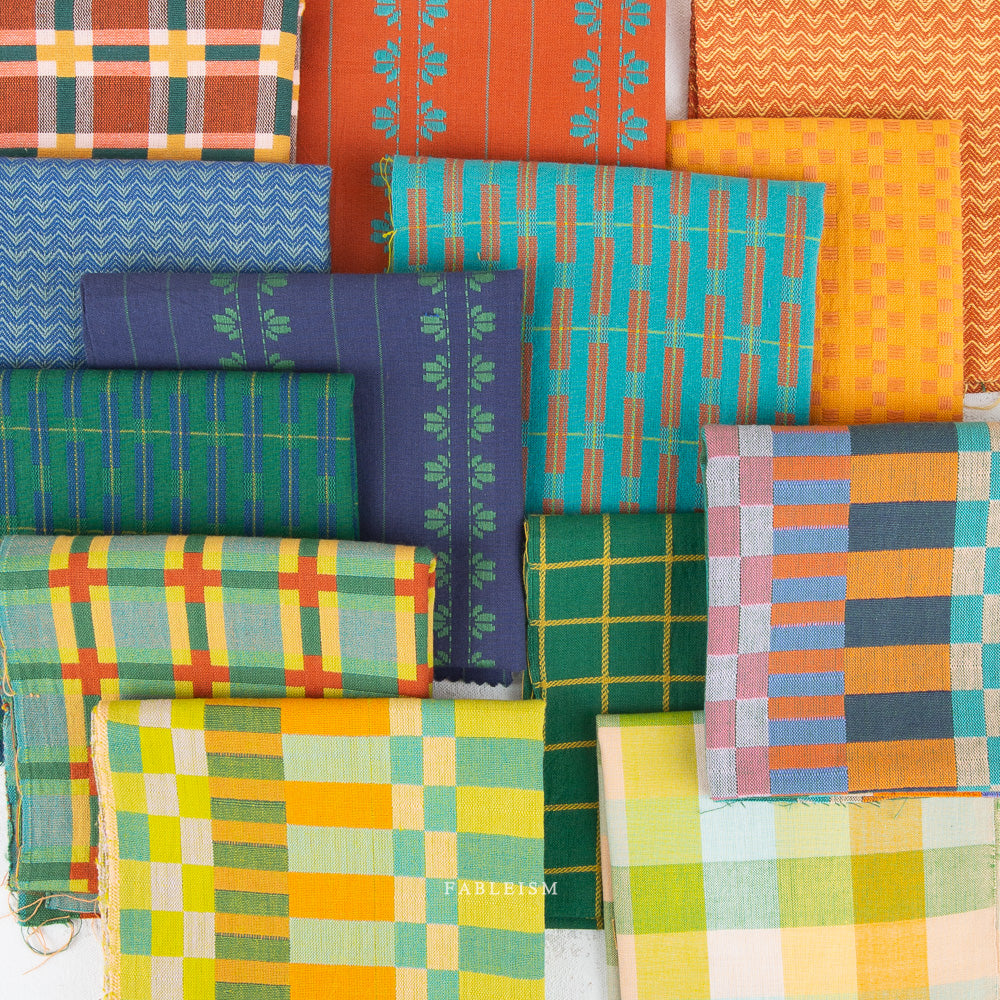 Collection of colorful fabric swatches with various patterns