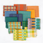 Collection of colorful fabric swatches arranged on a white background